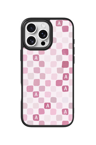 Flat lay view of personalized pink tiles grid initial design on custom iPhone 16 Pro Max case by MultiCustomize