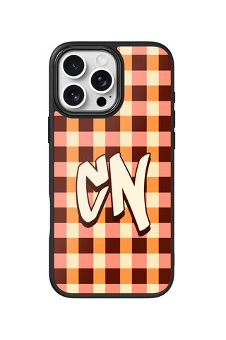 Flat lay view of personalized caramel checks monogram design on custom iPhone 16 Pro Max case by MultiCustomize