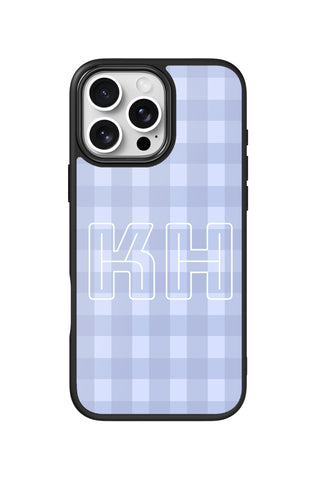 Flat lay view of personalized periwinkle check monogram design on custom iPhone 16 Pro Max case by MultiCustomize