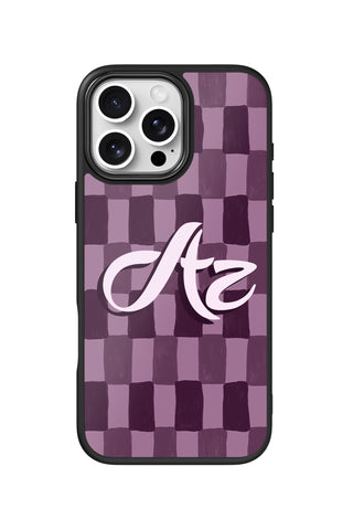 Flat lay view of personalized plum check monogram design on custom iPhone 16 Pro Max case by MultiCustomize