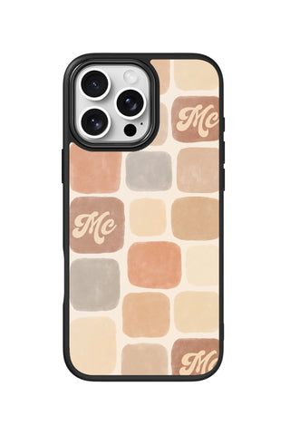 Flat lay view of personalized soft neutral grid monogram design on custom iPhone 16 Pro Max case by MultiCustomize