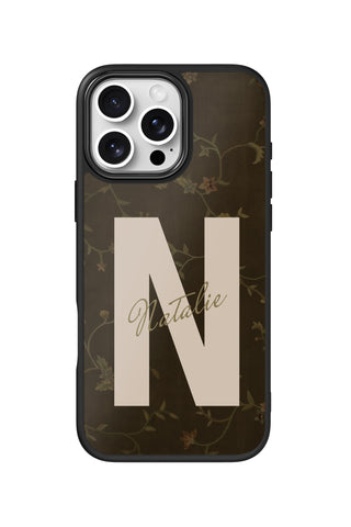 Flat lay view of personalized vintage vine monogram design on custom iPhone 16 Pro Max case by MultiCustomize