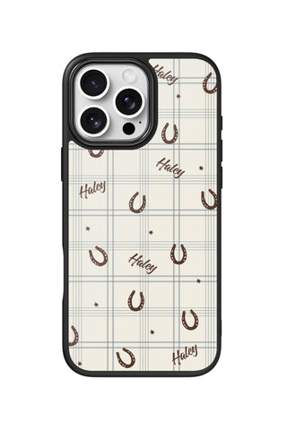 Flat lay view of personalized horseshoe plaid Name design on custom iPhone 16 Pro Max case by MultiCustomize